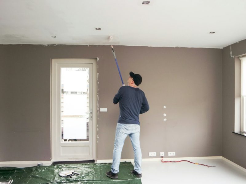 man-full-length-painting-the-ceiling-home-renovation-.jpg